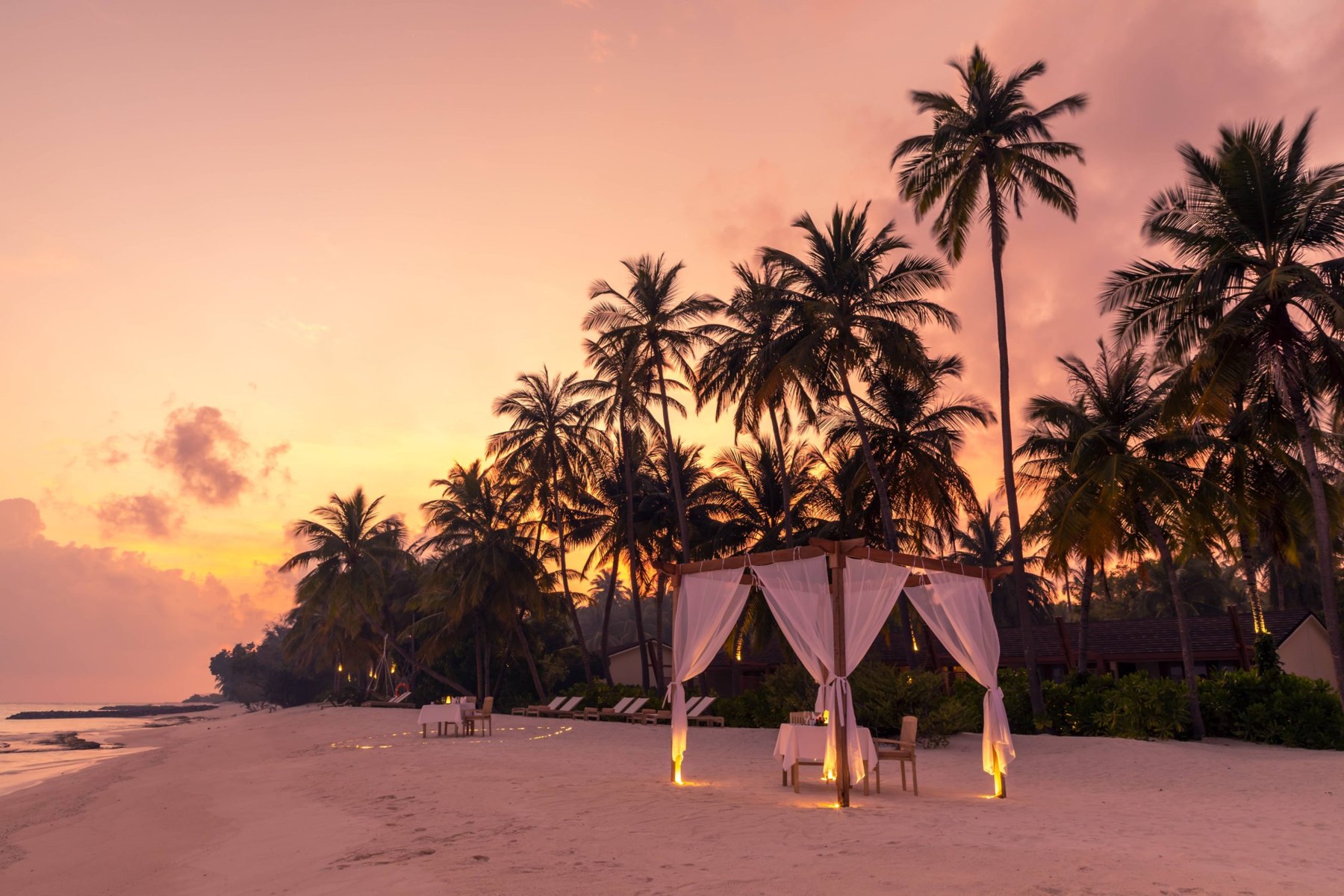 An island dining setting at Fiyavalhu Maldives
