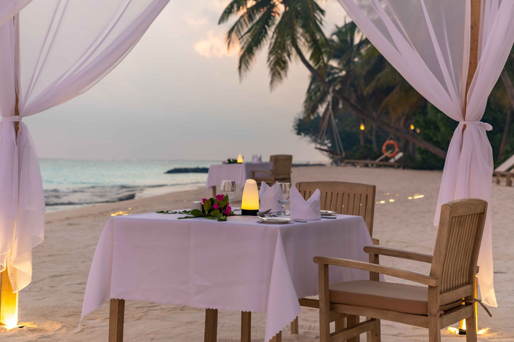 Private dinner under the pergola at Fiyavalhu Maldives