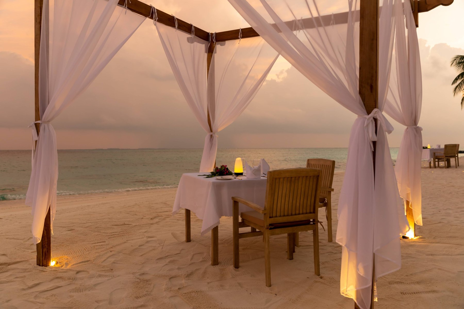 Private dinner under the pergola at Fiyavalhu Maldives